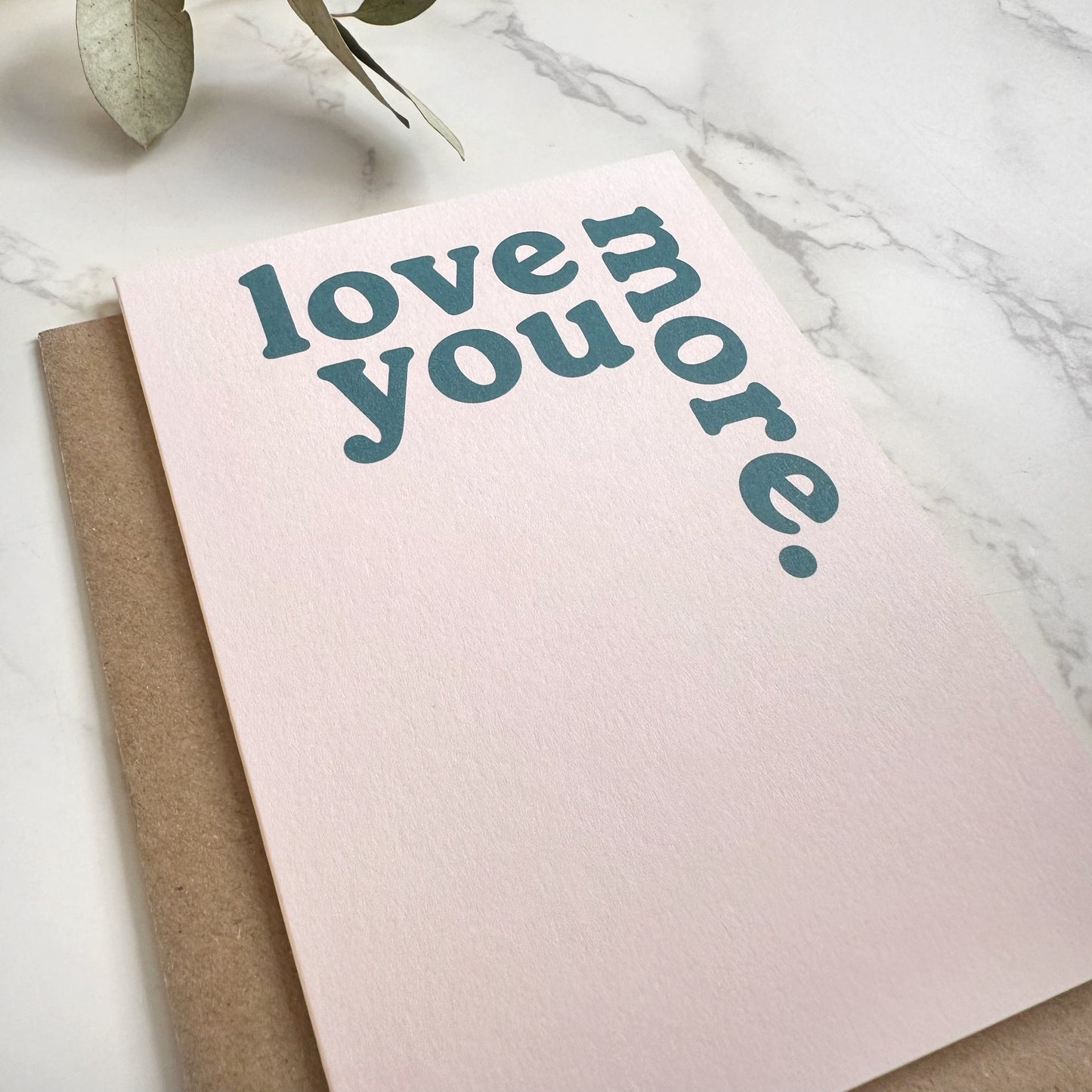 'Love You More.' Greetings Card