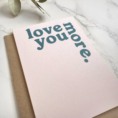 'Love You More.' Greetings Card