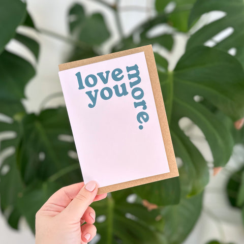 'Love You More.' Greetings Card